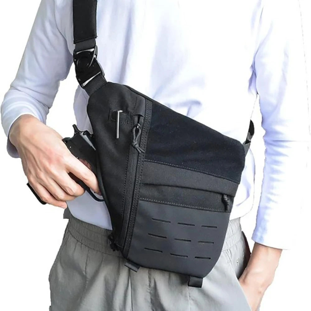 A black tactical crossbody sling bag worn across the chest, featuring multiple zipped compartments and MOLLE webbing.