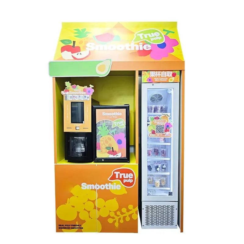 Yellow commercial slush and smoothie vending machine kiosk with a built-in refrigerated display and fruit graphics.