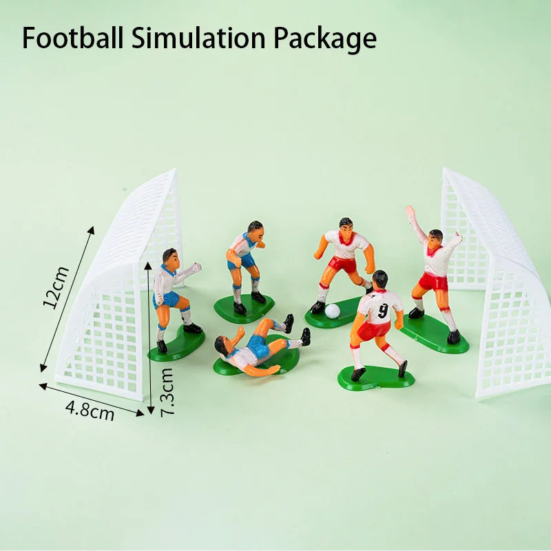 Miniature football playset with two white goal nets and six plastic player figures in red and blue kits on green bases.