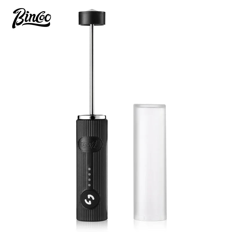 Black handheld electric milk frother with a ribbed handle, silver metal stem, and a clear protective cover.