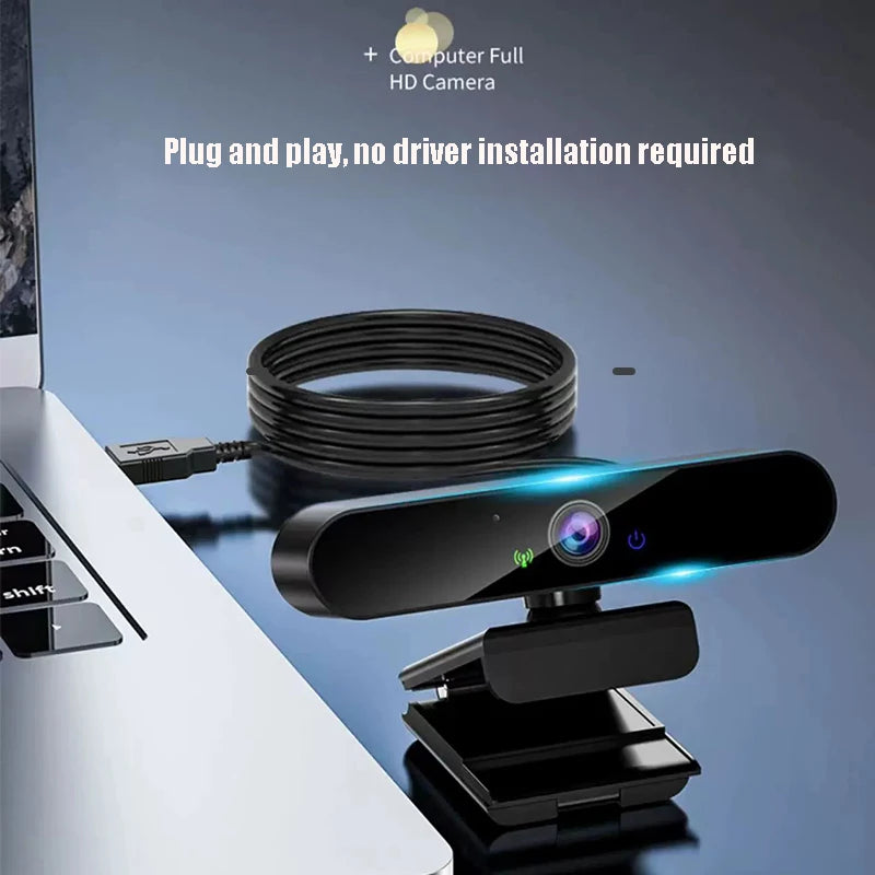 Sleek black 4K USB webcam with integrated microphone and adjustable mount, connected to a laptop.