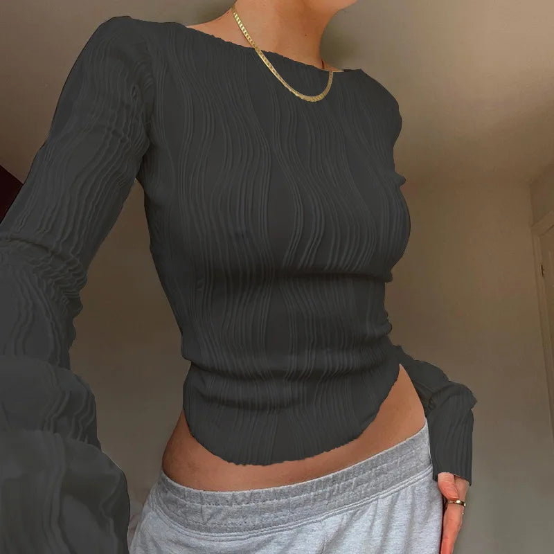 Charcoal grey long-sleeved top with a slim fit, round neckline, and vertical crinkle-textured fabric.