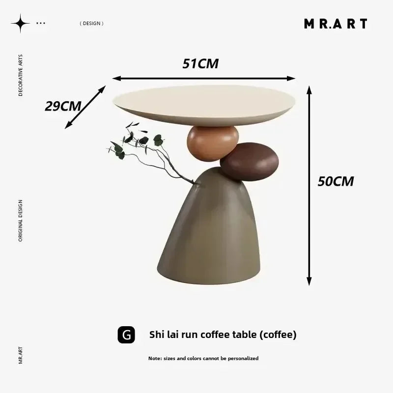 Minimalist cream-coloured side table with a unique stacked-stone base design. Dimensions: 51cm x 29cm x 50cm.
