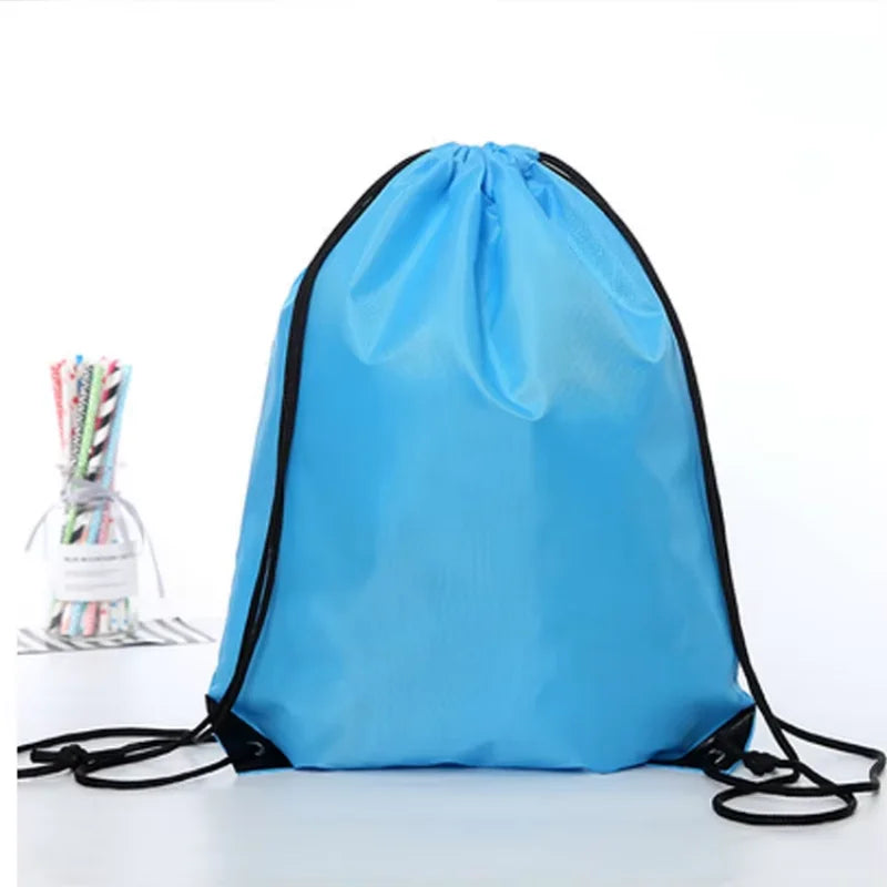 Bright blue drawstring bag with black cord straps, set against a plain white background.