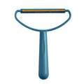 Blue handheld fabric shaver with a wide head and copper edge for removing lint and pet hair.