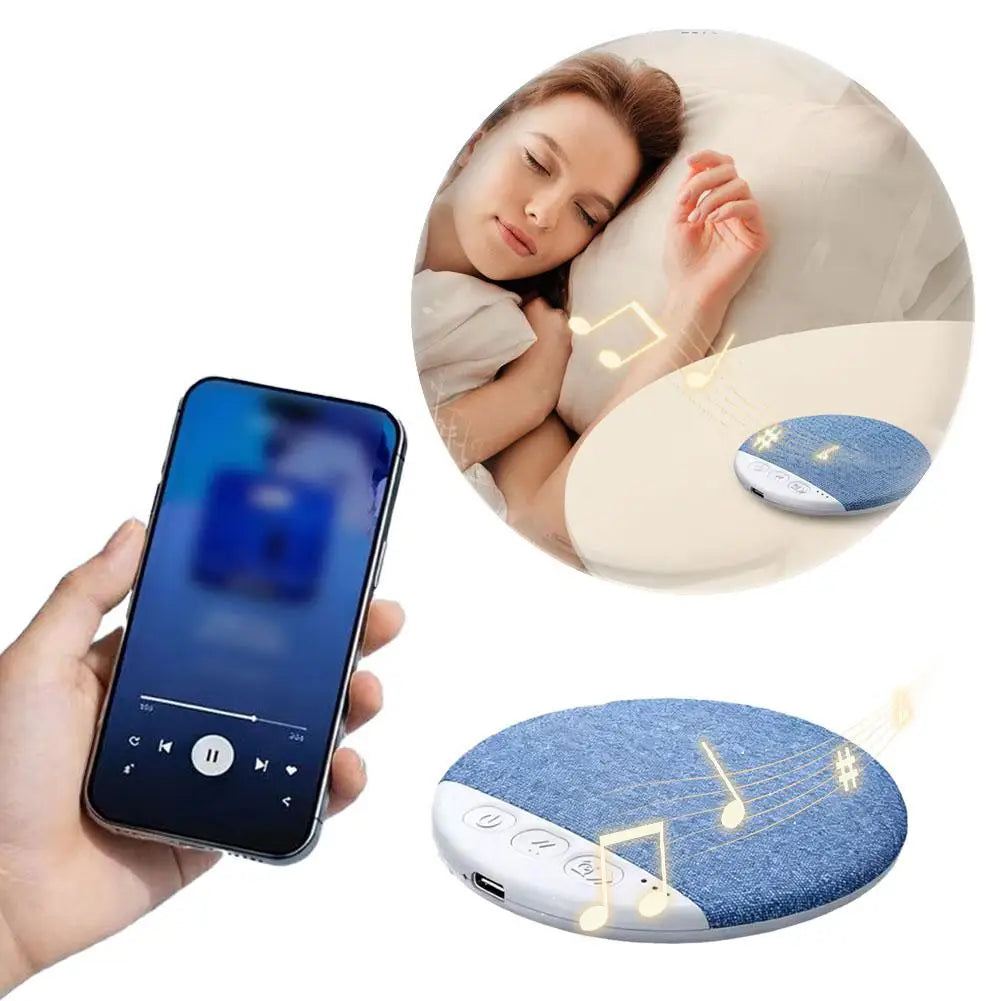 Round blue fabric pillow speaker with white control buttons, shown with a smartphone and a person sleeping.