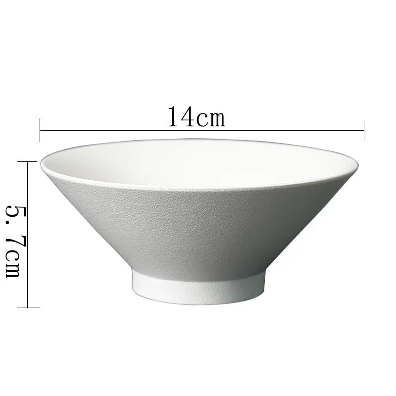 White ceramic bowl with a textured matte finish, 14cm wide and 5.7cm high, featuring a minimalist conical design.