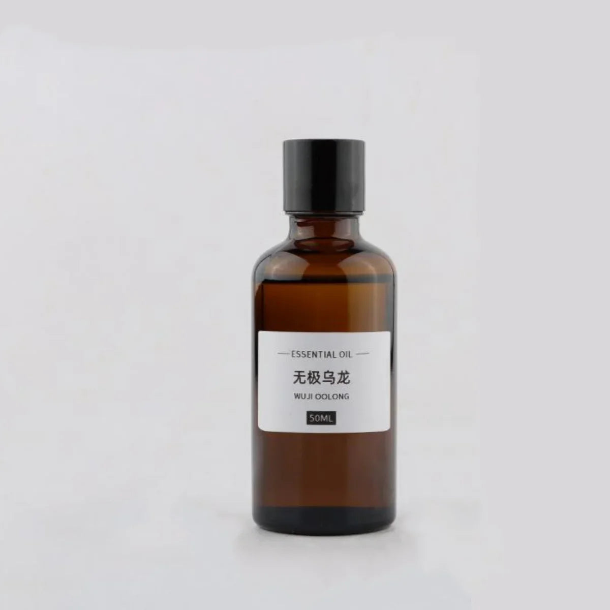 50ml amber glass essential oil bottle with a black screw cap and a white label reading Wuji Oolong.