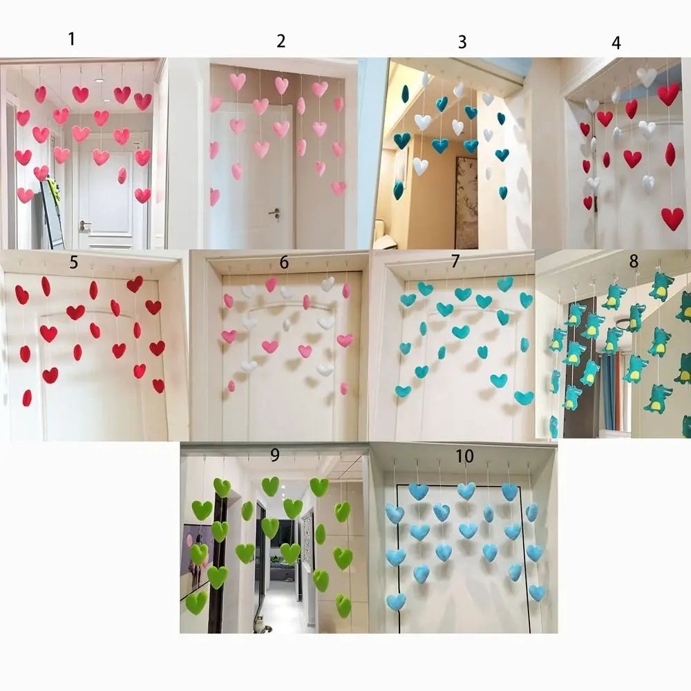 Set of ten hanging room decorations featuring felt hearts or dinosaurs in various vibrant colours, suspended on strings.
