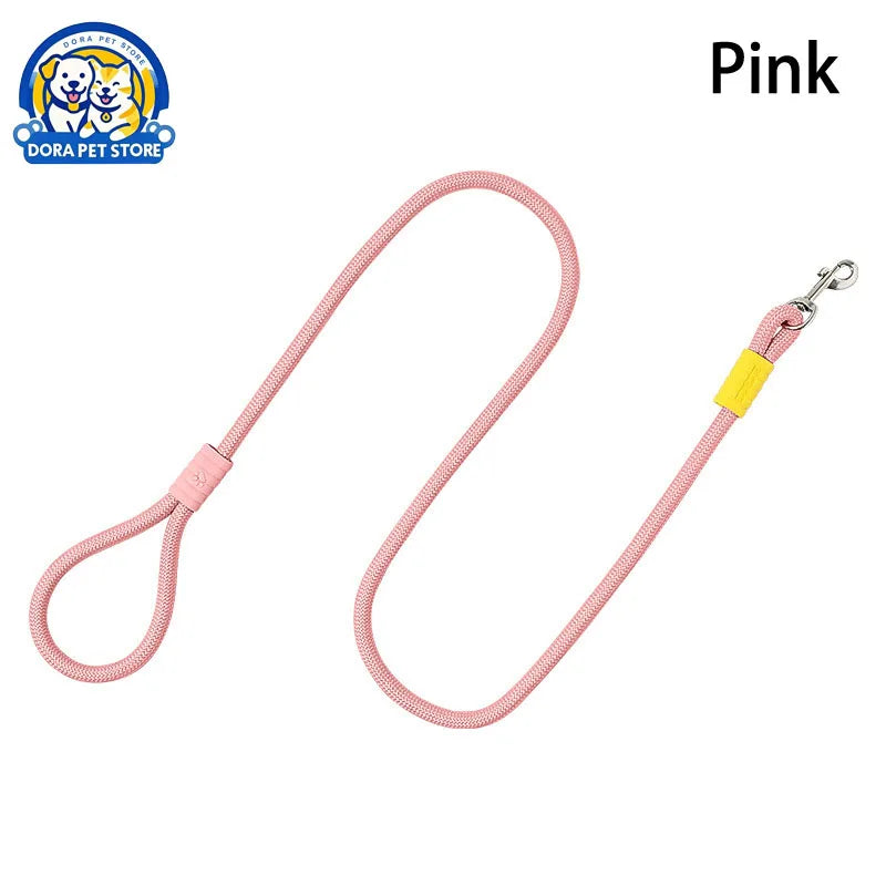 A pink rope dog leash with a yellow accent tab and silver metal clip.