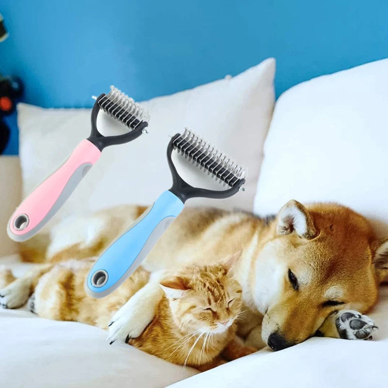 Two dual-sided pet grooming rakes in pink and blue, floating above a dog and cat sleeping on a white bed.