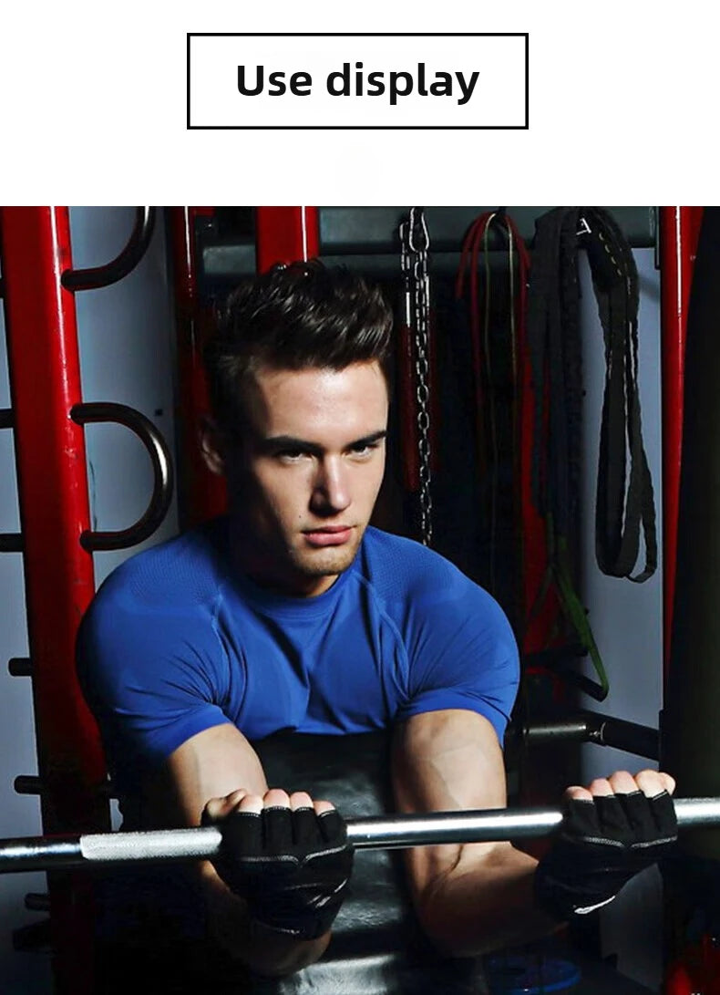 A man in a blue short-sleeved gym top and black fingerless weightlifting gloves, lifting a barbell in a gym.