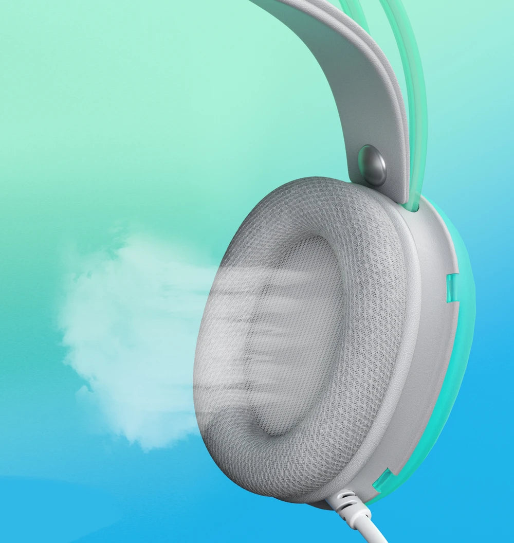 Close-up of a mint green and white wired gaming headset featuring breathable mesh ear cushions on a gradient background.