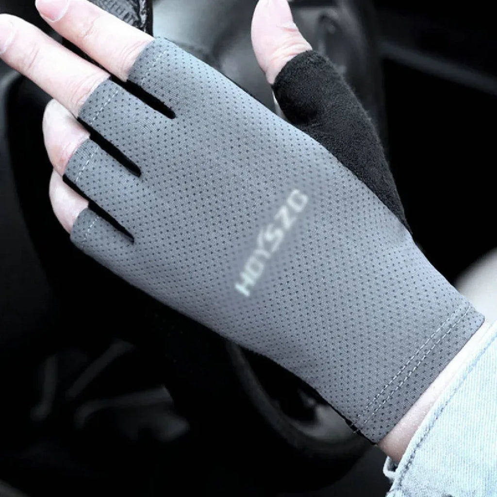 Grey fingerless driving gloves with a perforated finish, black thumb detail and branding on the back of the hand.