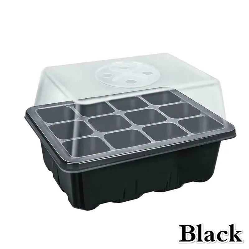 Black 12-cell plastic seedling tray with a clear, vented domed lid for plant propagation on a white background.