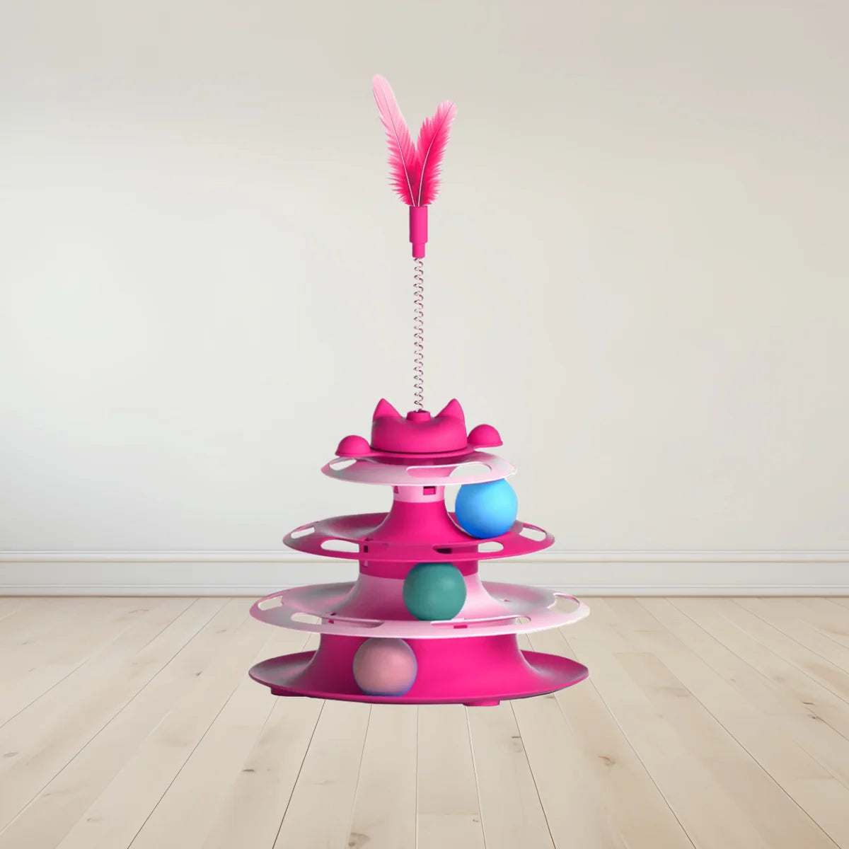 Pink multi-level interactive cat toy with three tracks containing colourful balls and a spring-mounted feather topper.