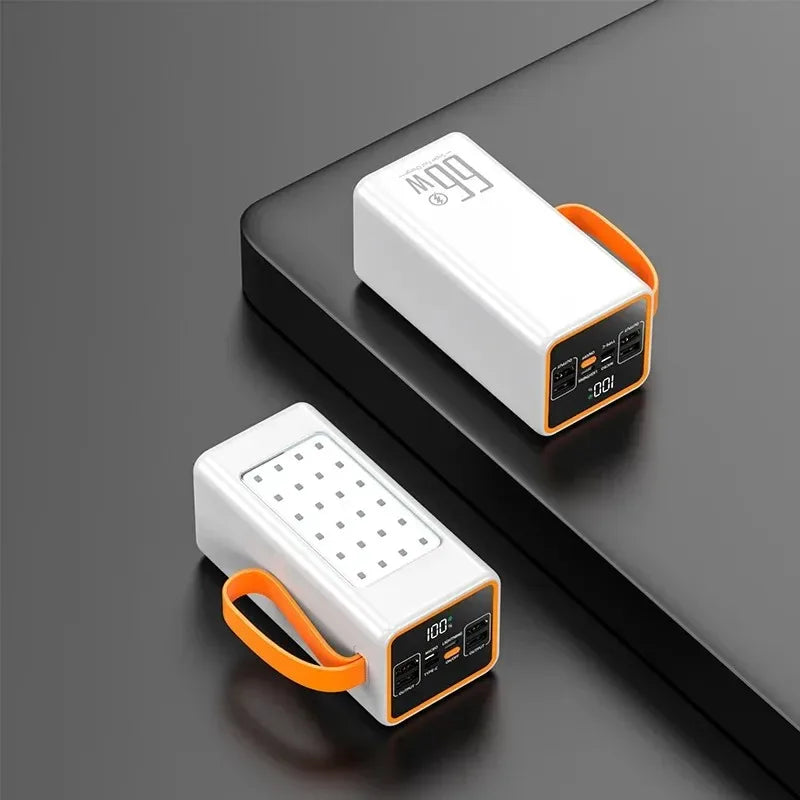 Two white portable power banks with orange carry straps, LED digital displays, and multiple USB charging ports.
