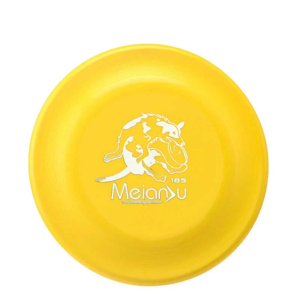 Bright yellow dog training frisbee with a white graphic of a dog catching a disc.