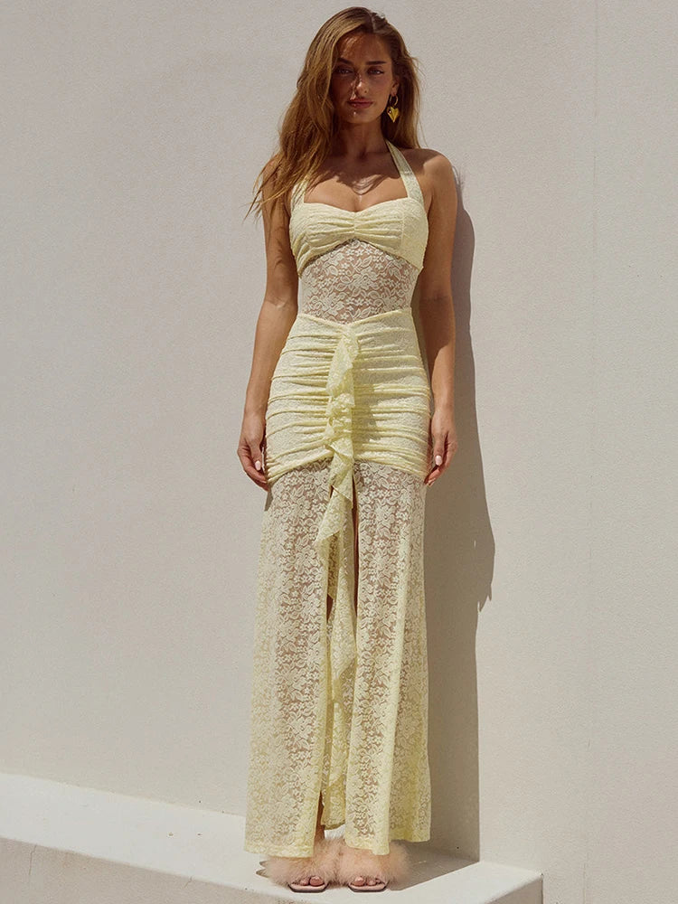 Pale yellow sleeveless lace maxi dress with ruched bodice, halter neck, and ruffled front slit.