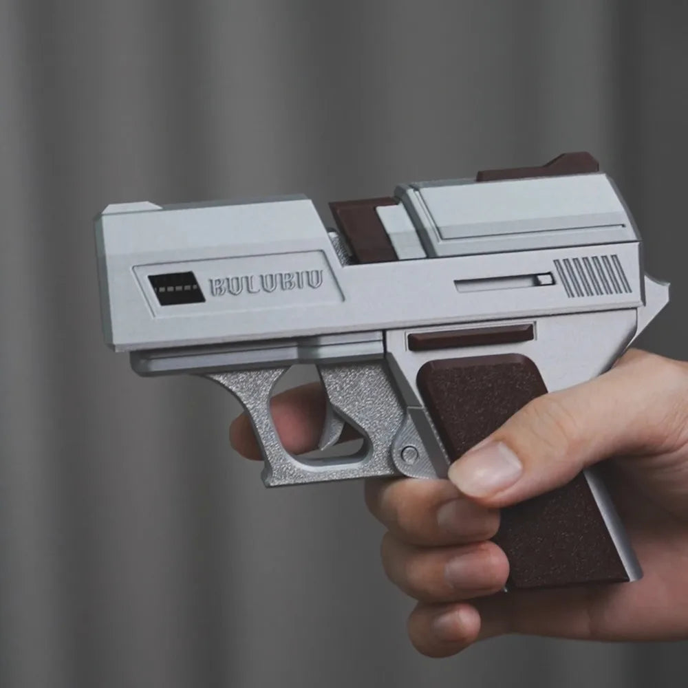 Silver and brown pistol-shaped AirPods case made of durable plastic, held in a hand.