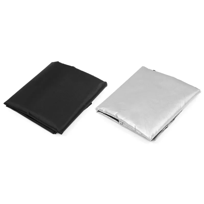 Two folded rectangular sheets on a white background, one black and one silver.