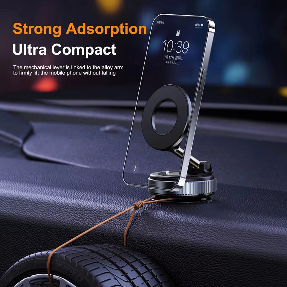 Compact, magnetic black and silver car phone mount attached to a dashboard, holding a smartphone upright.