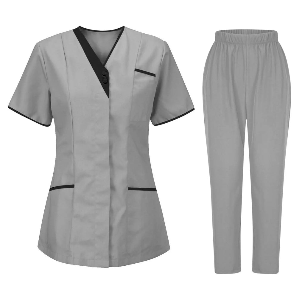 Grey women's uniform set featuring a short-sleeved V-neck tunic with black trim and matching elasticated trousers.