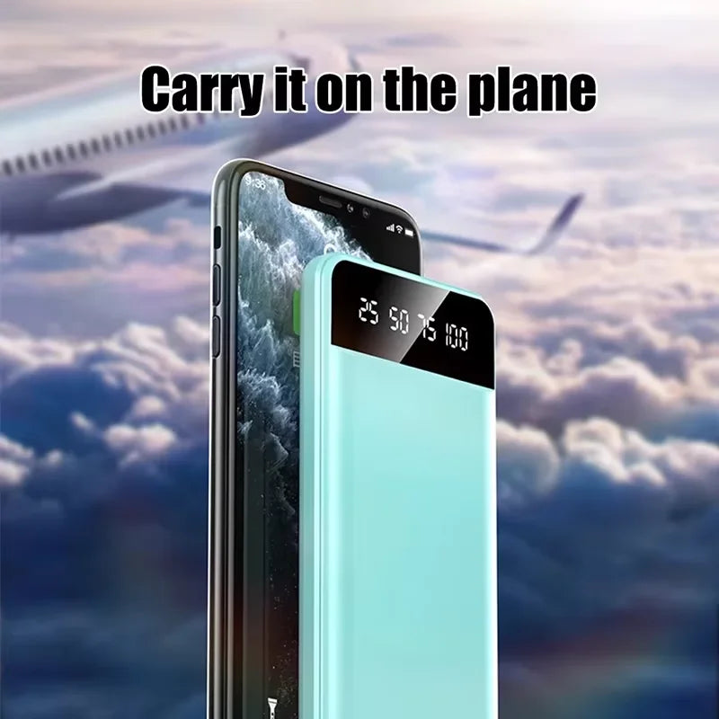 Light blue portable power bank with LED digital percentage display, shown next to a smartphone against a sky background.
