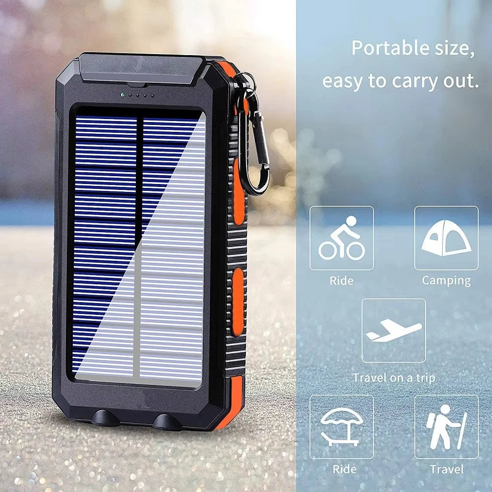 Rugged black and orange solar power bank with a built-in LED light and carabiner clip for travel and outdoor use.