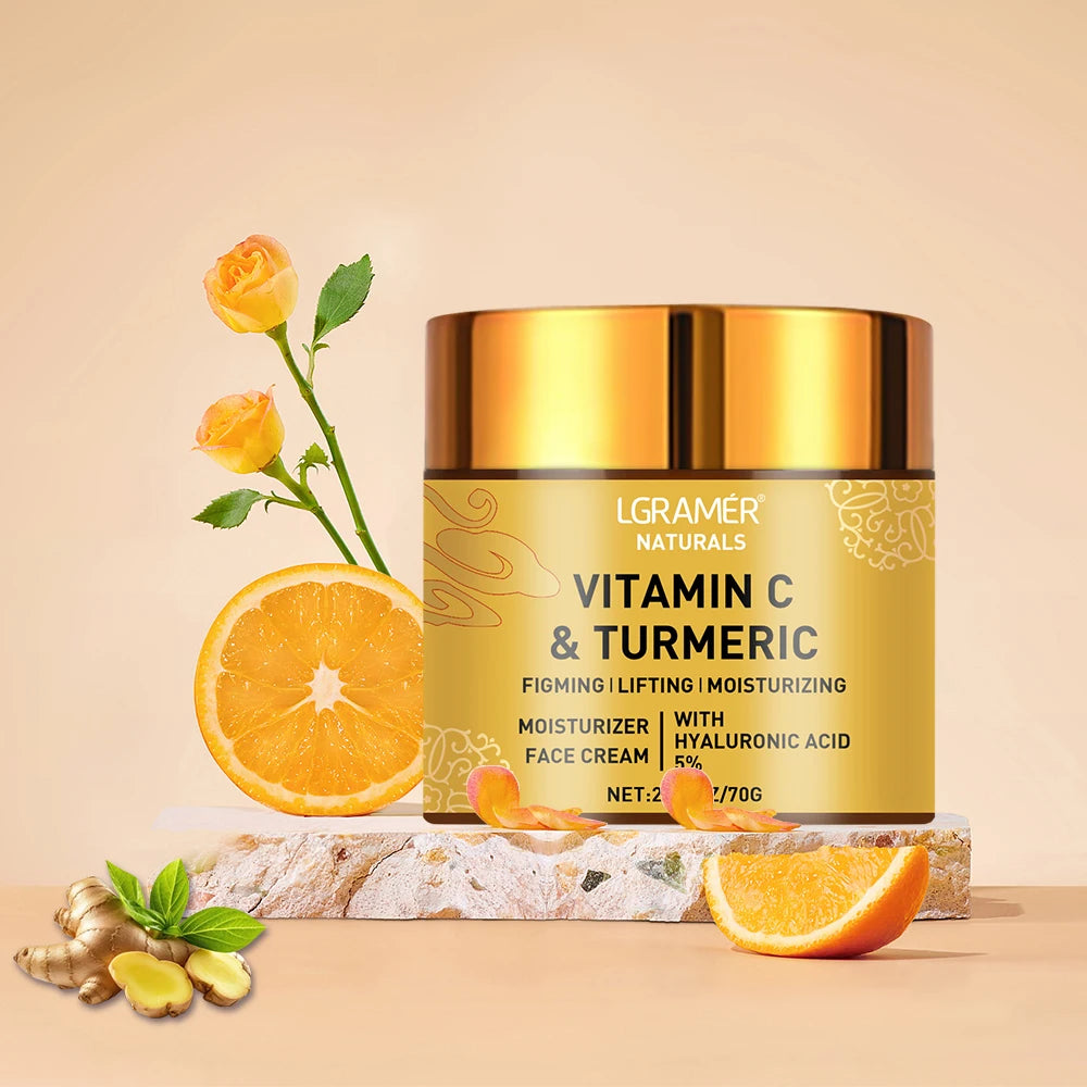A gold jar of Vitamin C and Turmeric face cream with hyaluronic acid, styled with orange slices, ginger, and roses.