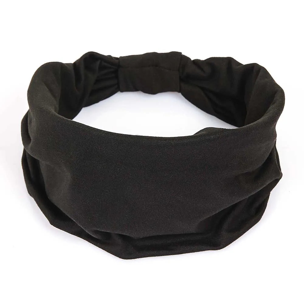 A wide, plain black fabric headband with a gathered elasticated section at the back.