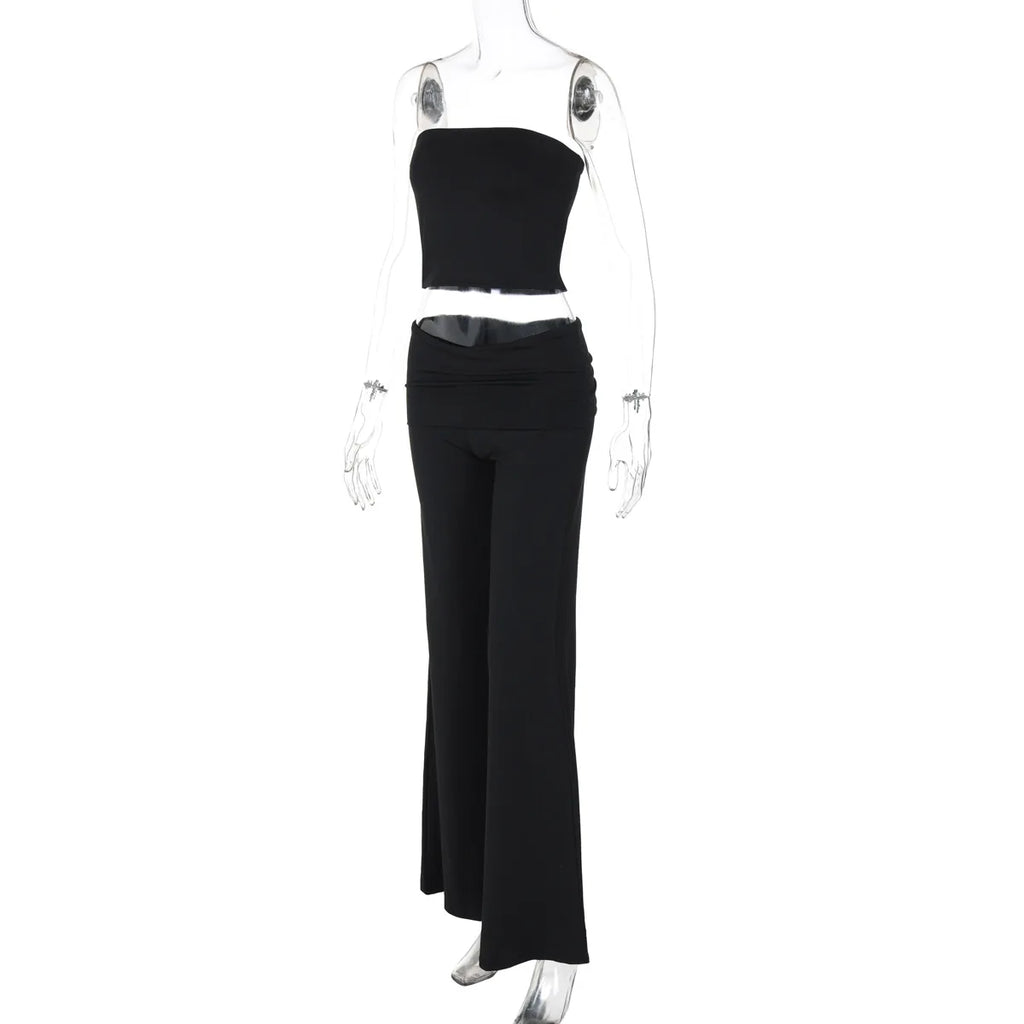 Black two-piece set featuring a strapless crop top and high-waisted wide-leg trousers on a mannequin.