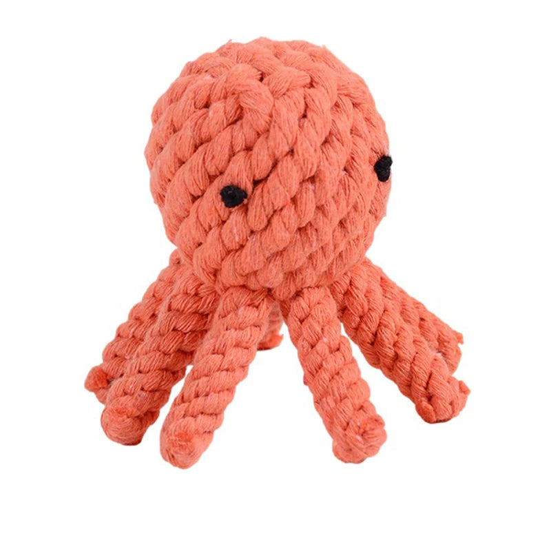 Coral-coloured octopus dog toy made from durable braided cotton rope with two small black stitched eyes.