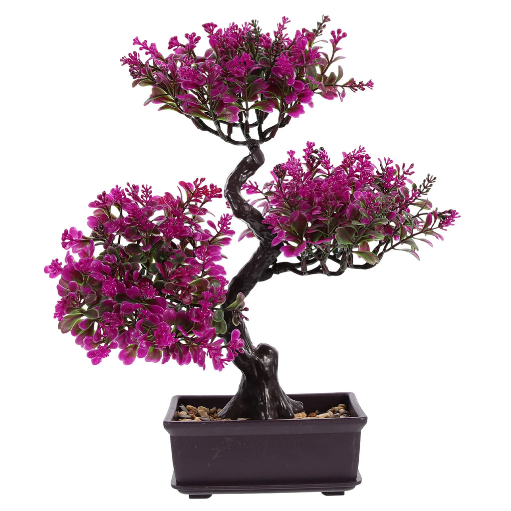 Artificial bonsai tree with vibrant magenta leaves, a dark brown trunk, and decorative pebbles in a rectangular pot.