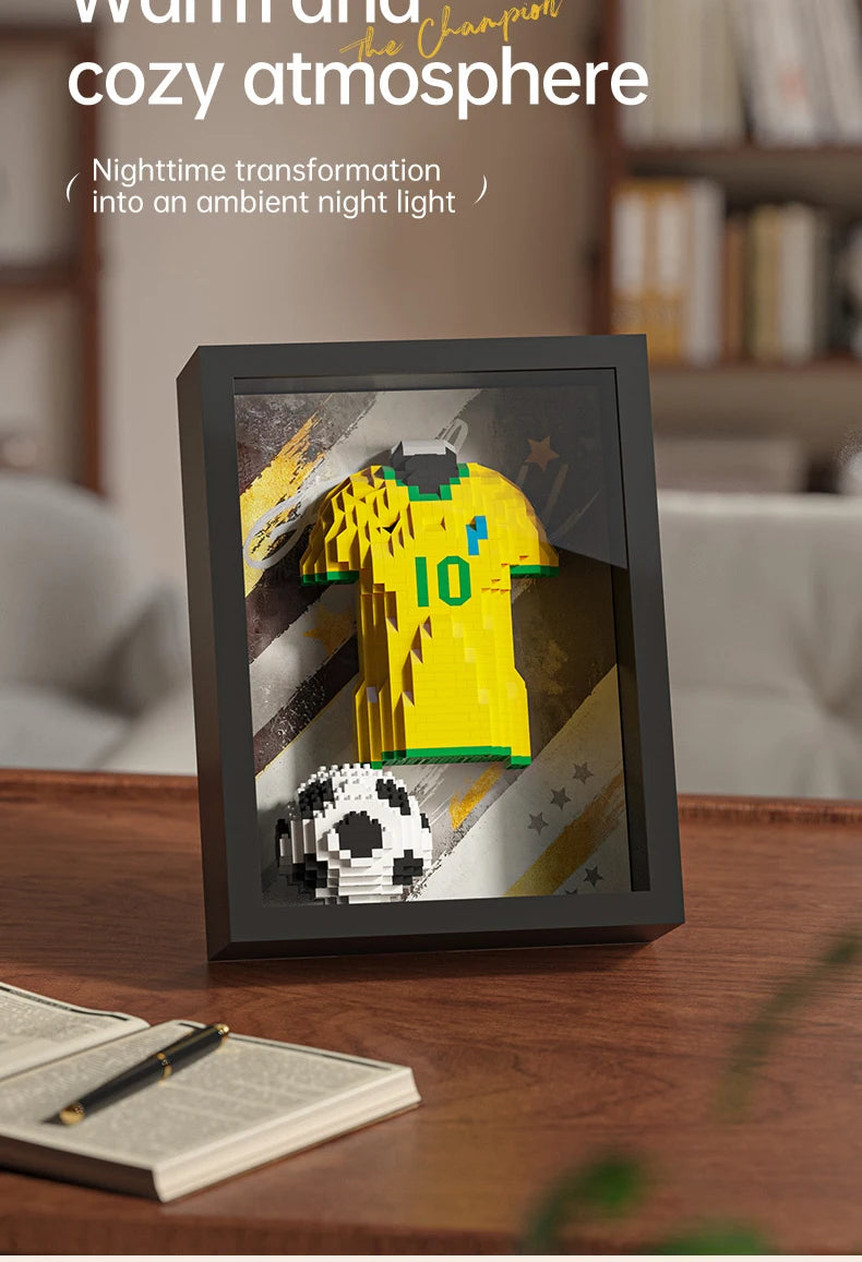 Black framed 3D brick art featuring a yellow number 10 football jersey and a soccer ball, serving as a night light.