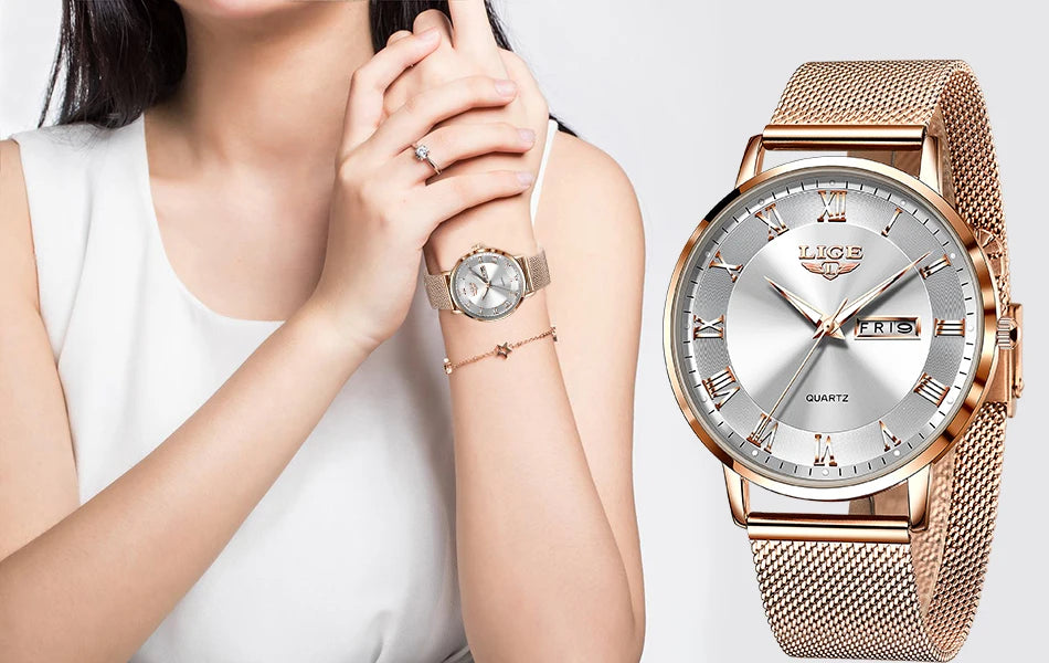 Elegant women's watch with a rose gold mesh bracelet, silver dial, Roman numerals, and a day-date window.