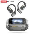 Dark grey wireless ear hooks with charging case featuring a digital display screen. Futuristic, gaming-style design.