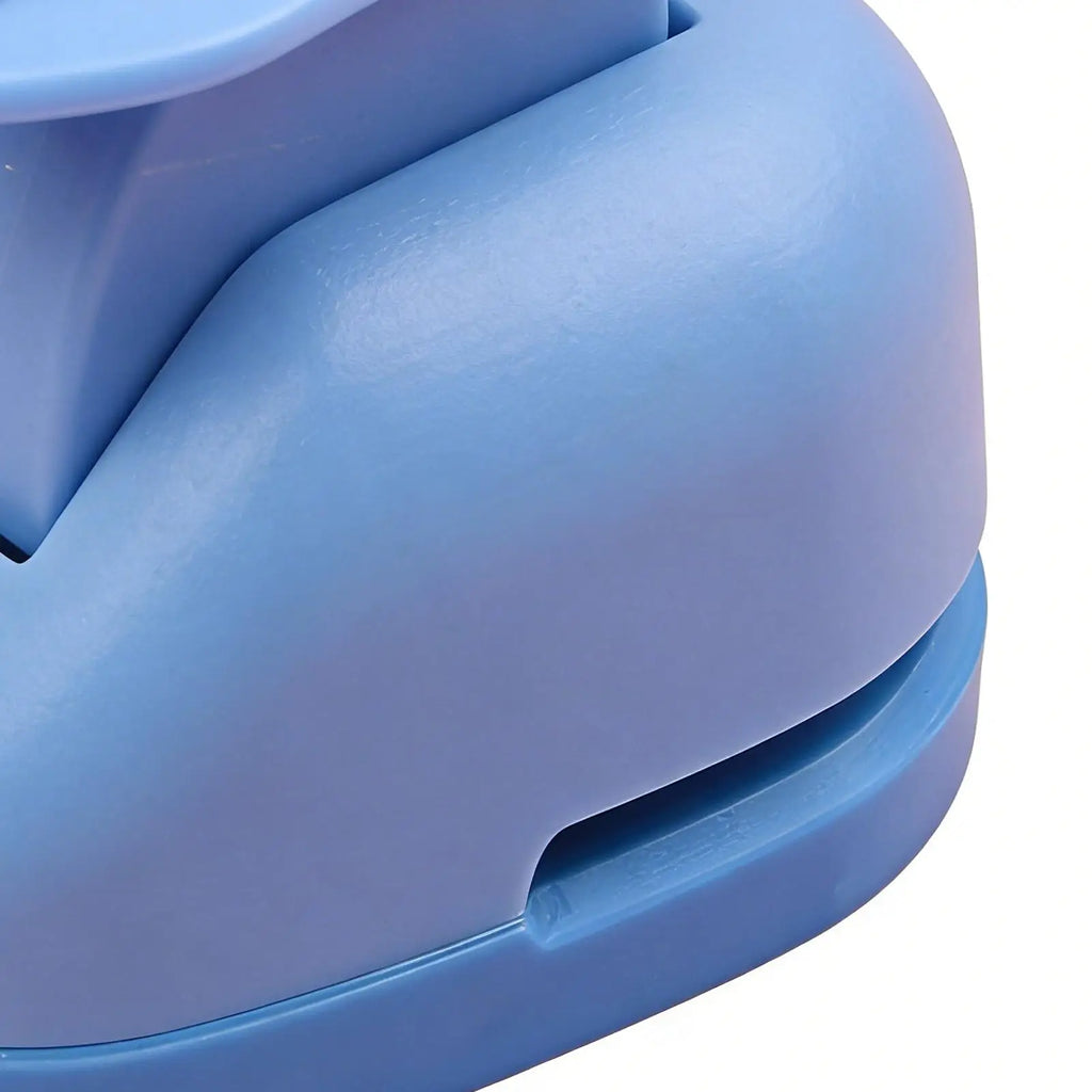 Close-up of a smooth, rounded light blue plastic stapler with a modern, ergonomic design on a white background.