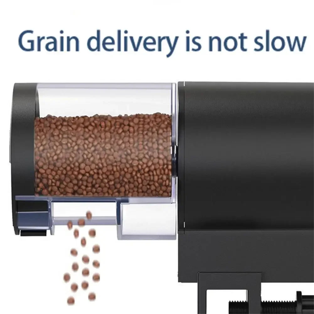 Black automatic pet food dispenser with a clear container showing dry kibble being dispensed.