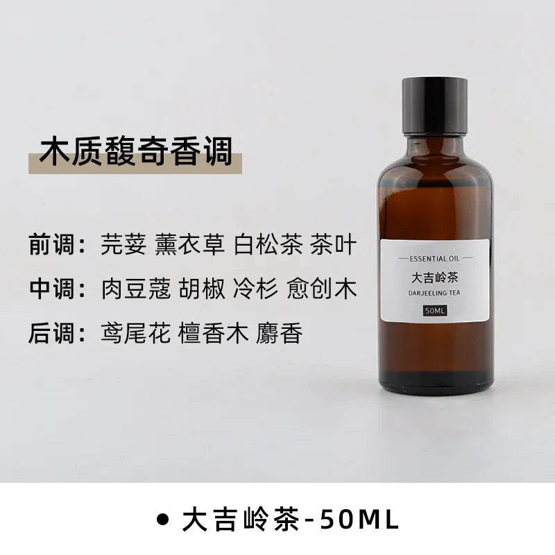 50ml amber glass bottle of Darjeeling Tea essential oil with a black screw cap and minimalist white label.