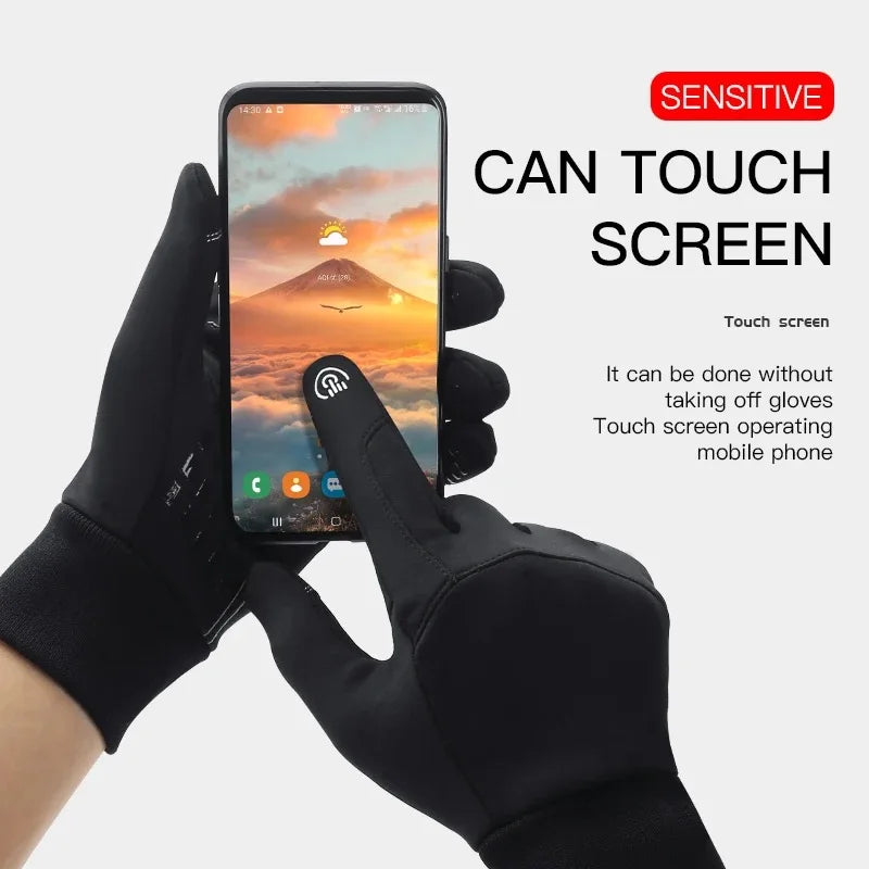 Black touchscreen gloves being worn to operate a smartphone.