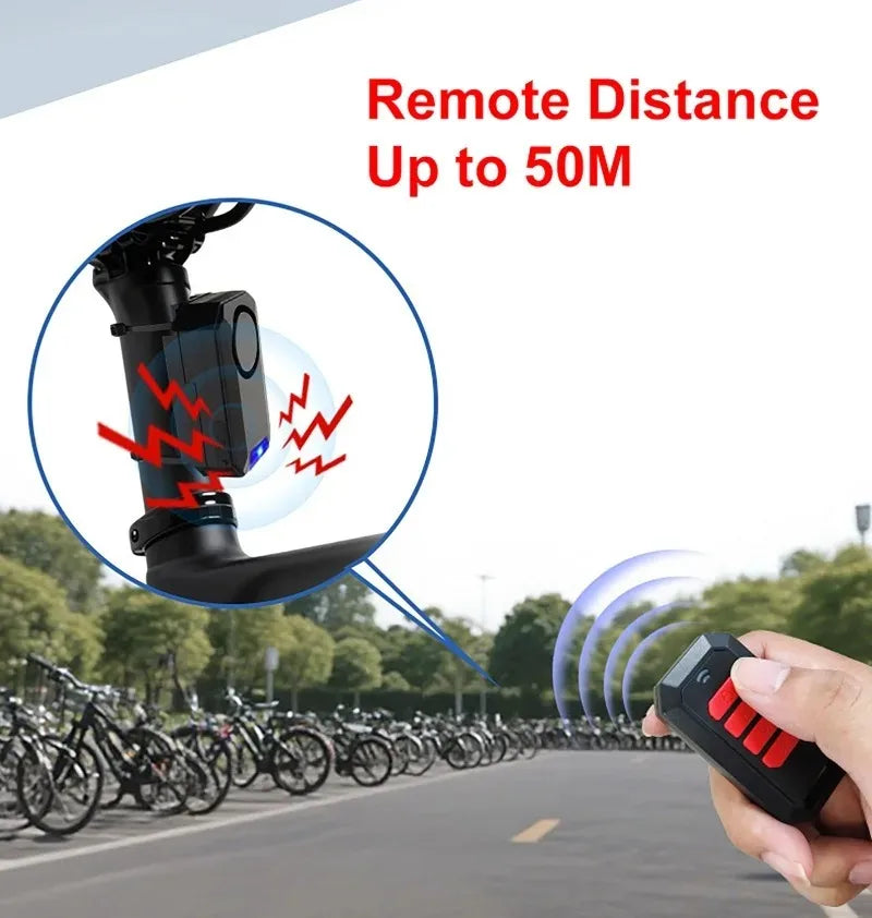 Black plastic bike alarm mounted on a seat post with a remote control, showing 50-meter wireless range.