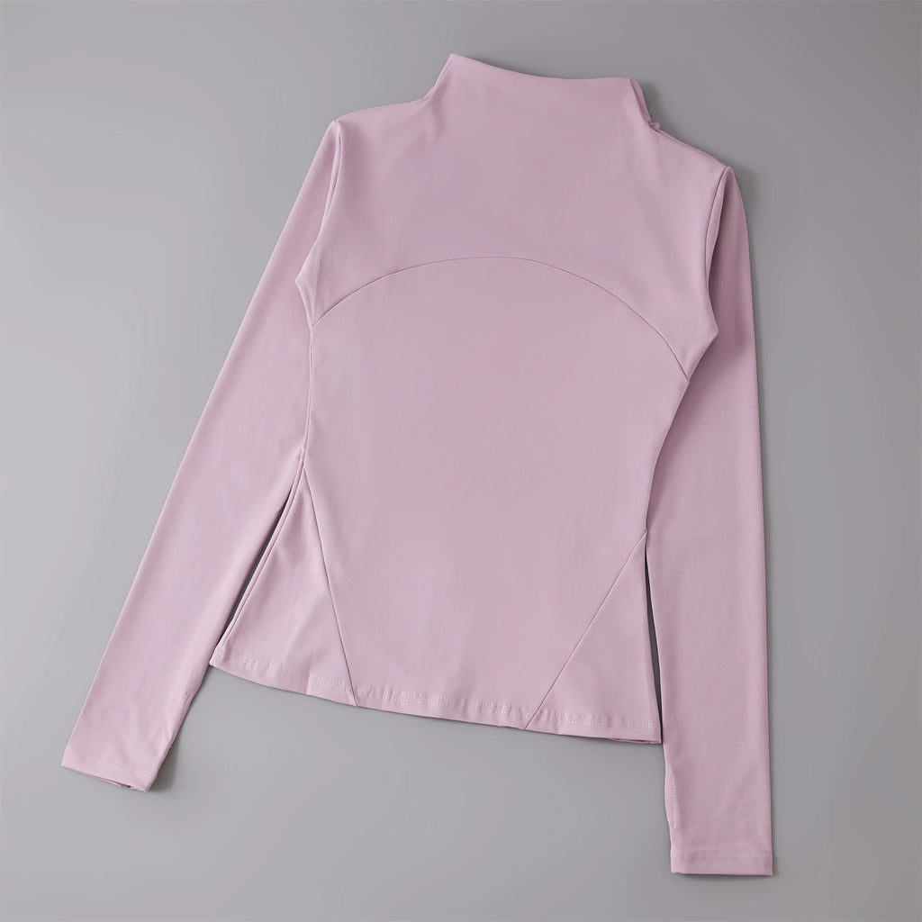 Dusty pink long-sleeve athletic top with a mock neck, curved chest panel, and fitted silhouette.