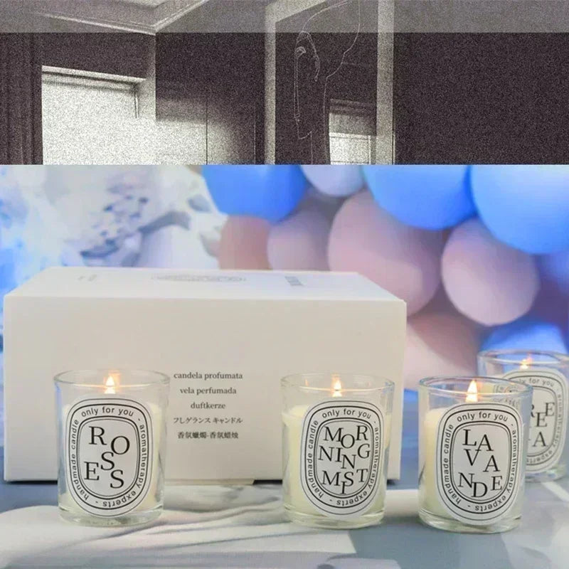 Gift set of three small, scented glass candles in a white presentation box, each with a minimalist circular label.