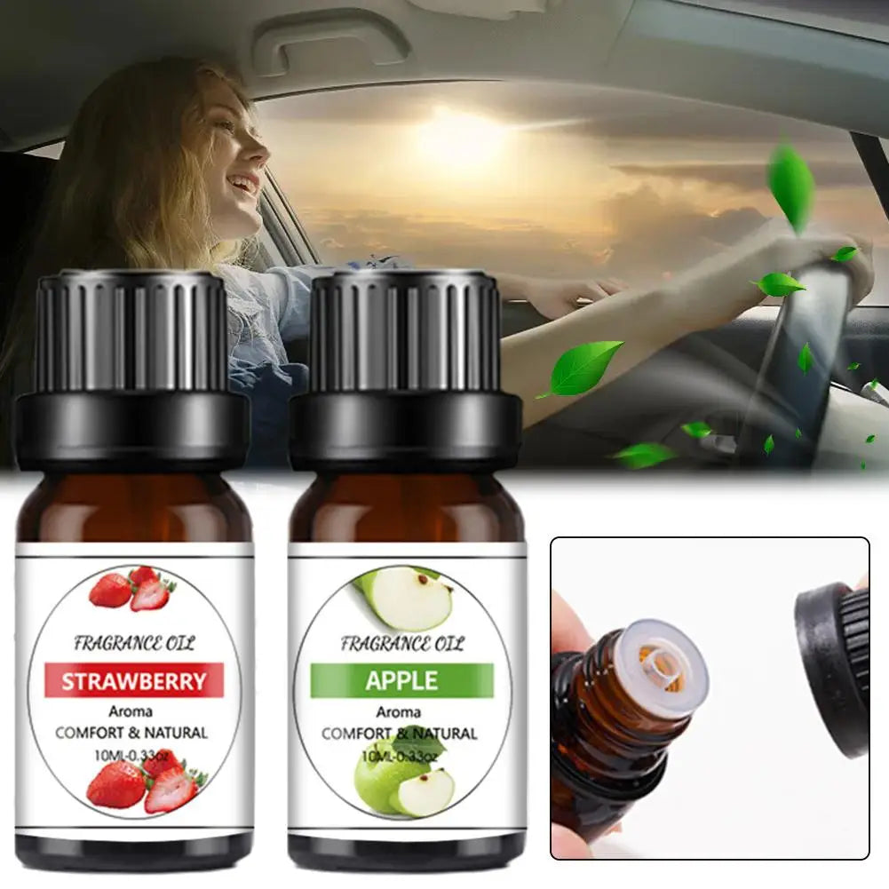 Two 10ml amber glass bottles of strawberry and apple fragrance oil for car use with dropper caps.
