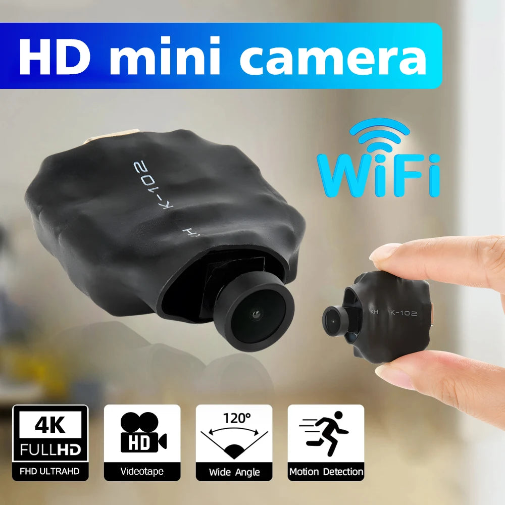 Small black plastic Wi-Fi mini camera with a 120-degree wide angle lens and motion detection capability.