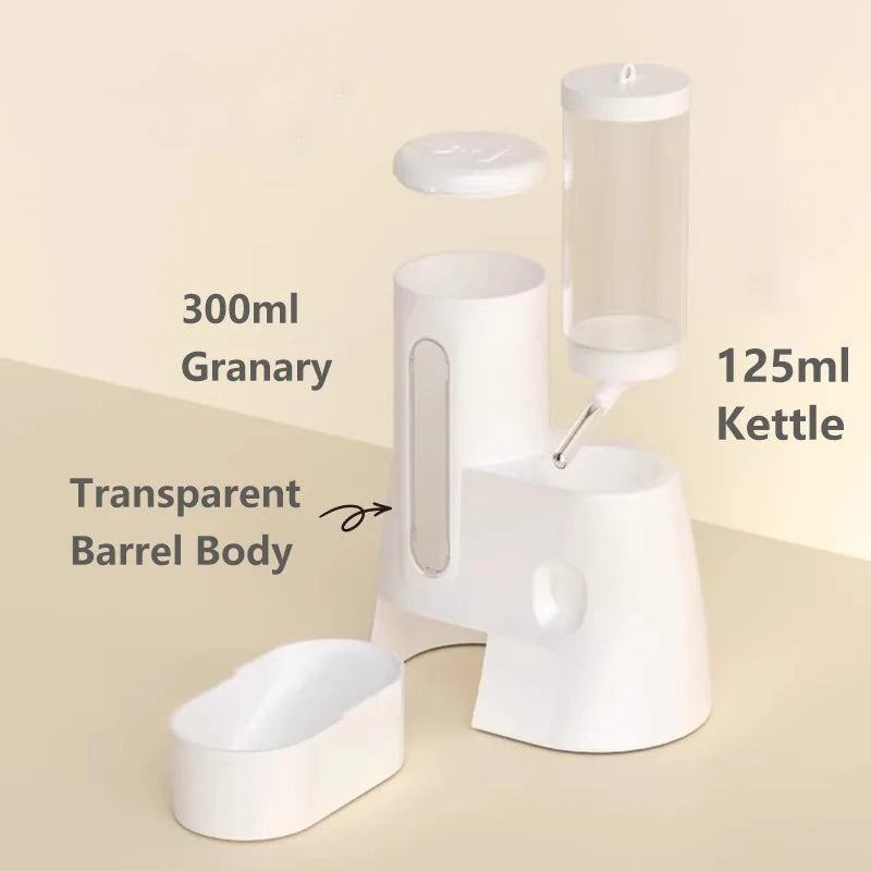 White, minimalist pet food and water station with a 300ml transparent granary and a 125ml detachable water bottle.