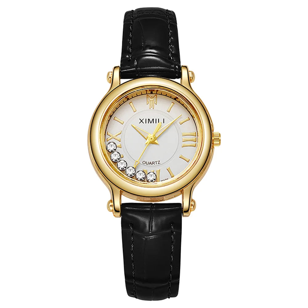 Women's quartz watch with a gold-tone case, white dial, crystal accents, and a black crocodile-effect leather strap.