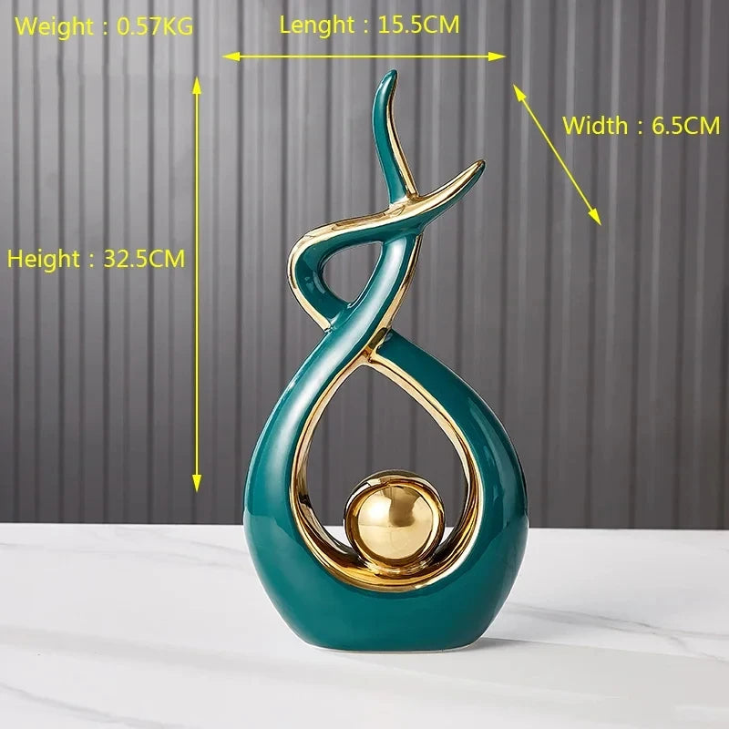 Modern abstract teal and gold ceramic angel sculpture with a smooth, curved design and central golden orb.