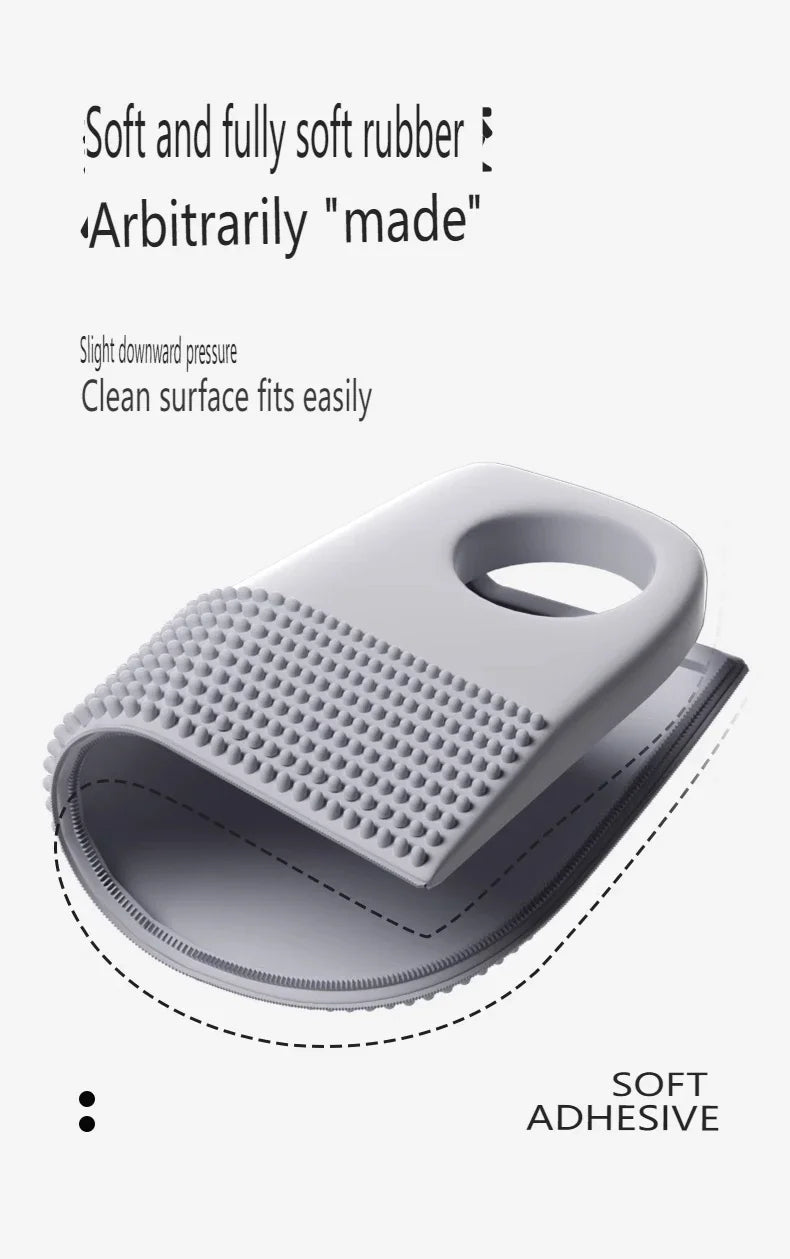 Grey flexible rubber door stop with a textured, studded surface and a hole for easy hanging or grip.